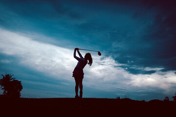 Professional woman golfer wearing sport wear teeing golf in at drive course training golf tournament competition at golf course for winner