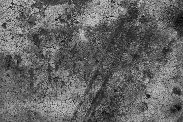Dark black and gray blurred wall background has a little abstract light