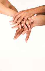 group of hands various races put in a stack
