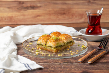 Turkish pistachio baklava. Turkish cuisine delicacies. Baklava on wood background. close up