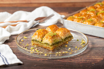 Turkish pistachio baklava. Turkish cuisine delicacies. Baklava on wood background. close up