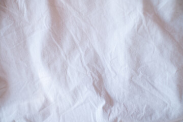 Fototapeta na wymiar Clean white paper, wrinkled background, abstract. crumpled white paper, white bed linen gradient texture blurred curve style of abstract luxury fabric,Wrinkled bed linen and dark gray shadows