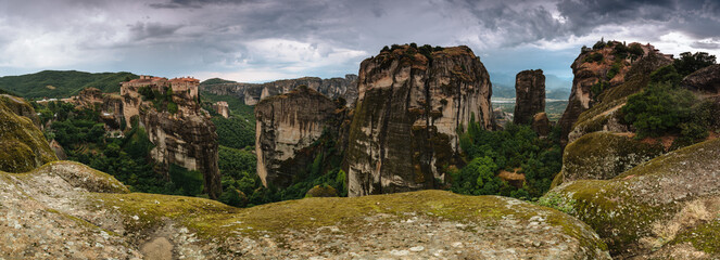 Fototapeta premium Amazing panoramic landscape of monastery on a rock. The Monastery of Great Meteoron is an Eastern Orthodox monastery. Meteora monastery complex. Thessaly. Greece. UNESCO World Heritage List.