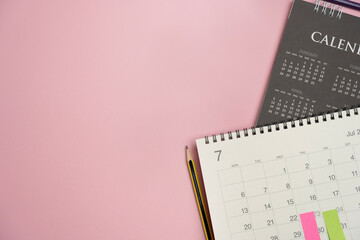close up of calendar on the colorful table background, planning for business meeting or travel planning concept