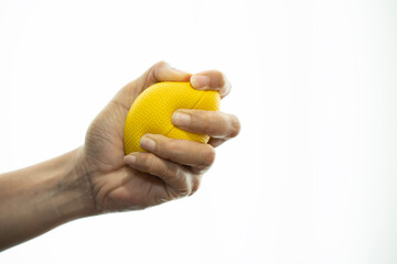 woman hand holding stress ball on isolated white background