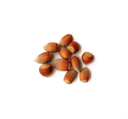 Hazelnuts isolated on white background. A pile of delicious and healthy hazelnuts isolated on a white background. Healthy food concept.                                             