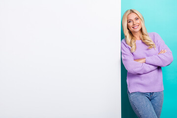 Photo of confident business lady folded hands wear purple knitted sweater near her brand name empty space advert isolated on blue background