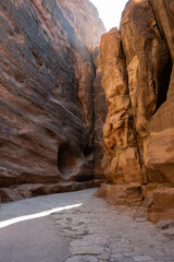 Al Siq Gorge in Petra, Jordan with Ancient Nabataean Cobblestone or Stone Slab Paved Road