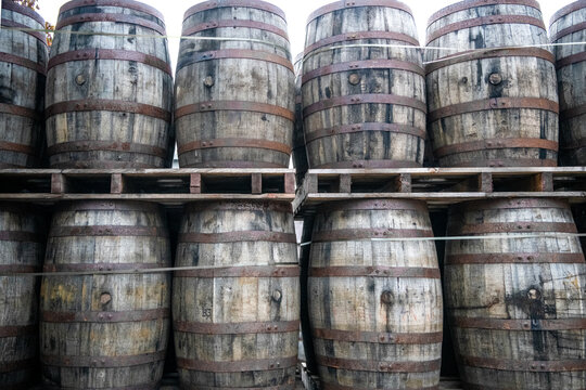 Close-up of a stack of whisky Barrels on wooden pallets, Ireland