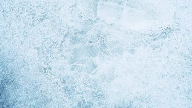 Texture of ice on the frozen lake. Blue color background.
