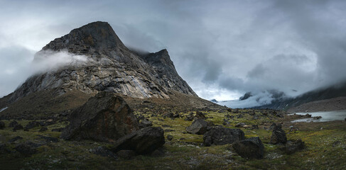 Hiking in wild, remote arctic valley of Akshayuk Pass, Baffin Island, Canada