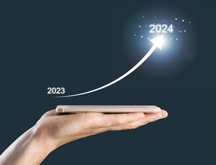 Businessman holding 2023 number, new year concept.