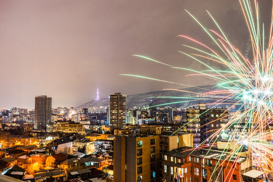 Fireworks exploding over downtown cityscape, Tbilisi, Georgia