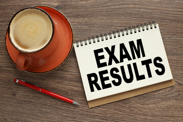 Exam Results orange cup of coffee with notepad with text