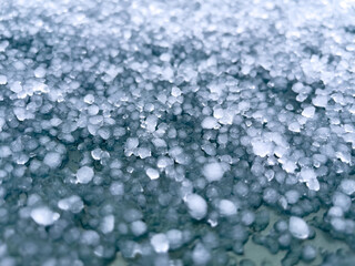 Large hailstones on a dark background. background, texture. Close-up.