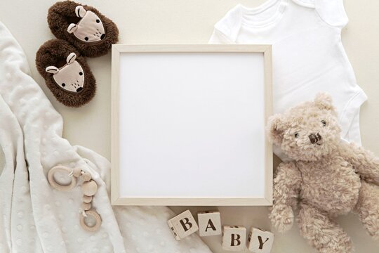 Wooden square frame mockup, blank frame for pregnancy announcement design, baby name sign, nursery art presentation.