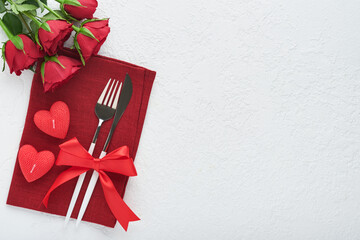 Valentines day romantic table setting. Empty or closeup of a dinner black plate, knife, fork and...