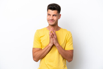 Young caucasian man isolated on white background scheming something