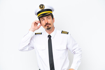 Airplane caucasian pilot isolated on white background having doubts and with confuse face expression