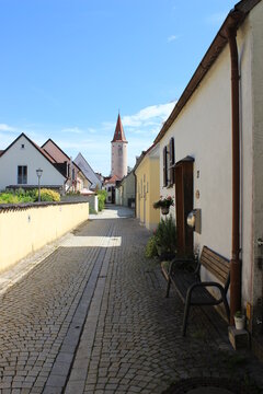 Old street with medieval watchtower in a small town. Germany, Bavaria, Mindelheim.