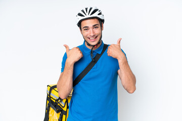 Young caucasian man with thermal backpack isolated on white background with thumbs up gesture and smiling