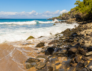 Fototapeta na wymiar Waves Rolling on The Rugged Shoreline of Slaughterhouse Beach, Maui, Hawaii, USA