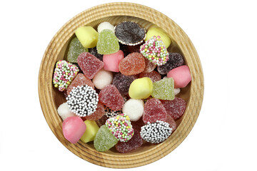Dutch tum tum candies in a wooden bowl isolated on white background