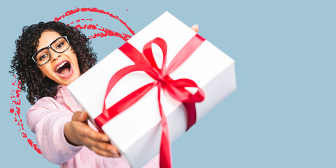Happy african american curly lady in casual laughing while holding present gift box isolated over blue background.