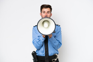 Young police caucasian man isolated on white background shouting through a megaphone