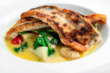 Fried perch fillet with boiled potatoes in a creamy sauce