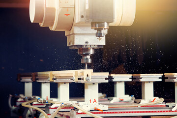Close-up of a large automatic milling machine for processing wood products. © SKfoto