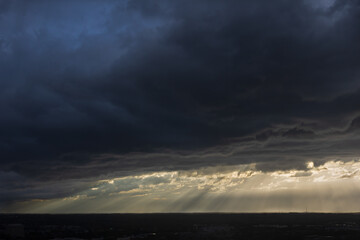 Sunbeams cut through threatening storm clouds over midtown Atlanta