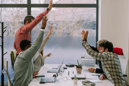 Happy People With Hands In The Air