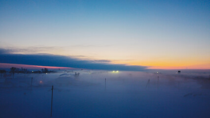 Thick fog on the background of a beautiful sunset v1