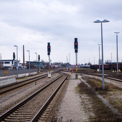 Fototapeta na wymiar View of a railyard with railway signals on red