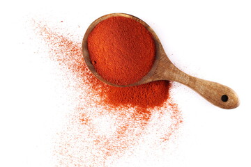 Red paprika, cayenne pepper powder in wooden spoon pile isolated on white, top view 