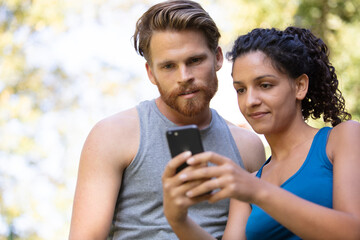 hikers using smartphone while hiking