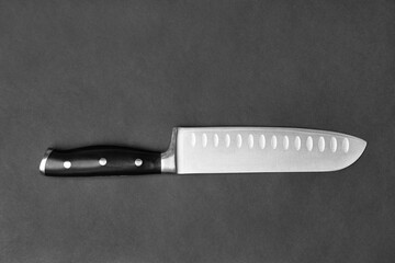 Large kitchen knife on a black background top view - Powered by Adobe