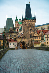 View of the Lesser  Bridge Tower of Charles Bridge in Prague (Karluv Most) the Czech Republic. This bridge is the oldest in the city and a very popular tourist attraction.