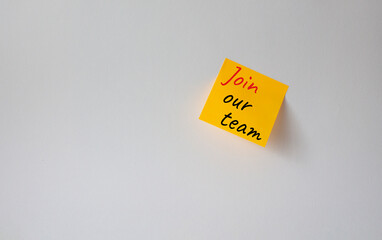Join our team symbol. Concept words Join our team on orange steaky note. Beautiful white background. Business and Join our team concept. Copy space.