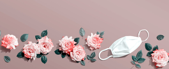 Face mask with pink roses overhead view