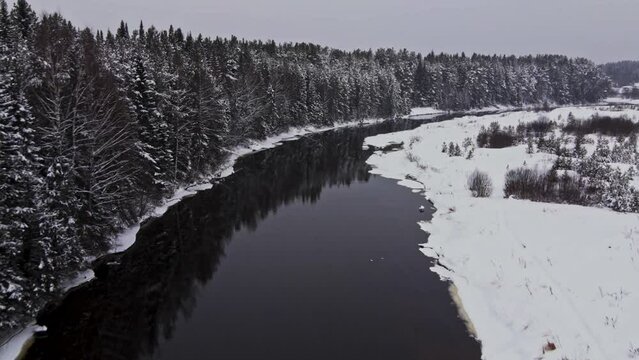 Ice covering river water in cold winter landscape with frozen natural texture