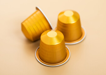 Coffee capsules pods for coffee machine on beige background.