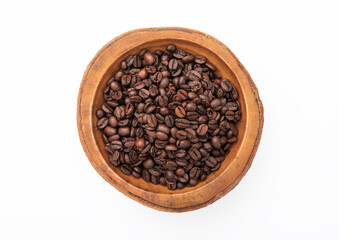 Fototapeta premium Raw coffee beans in wooden bowl plate on white background.