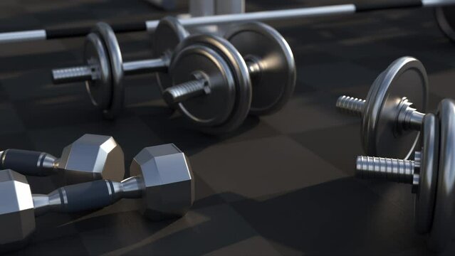 Barbell, kettlebells and dumbbells on floor on black mats background, sport, fitness, exercise or weightlift concept.