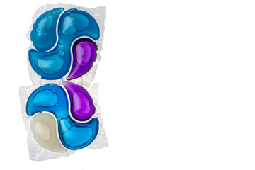 Washing gel capsule pod with laundry detergent isolated on white background.