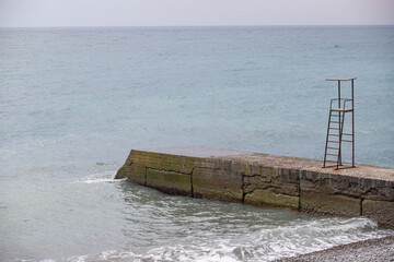 Landscape seashore, sea pier in clear weather.