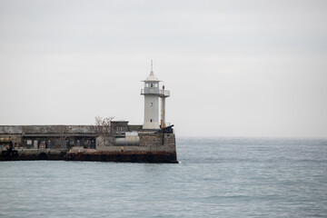 Fototapeta na wymiar Landscape seashore, sea pier in clear weather.