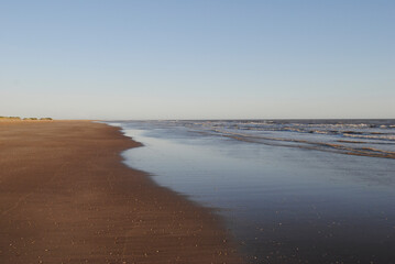 Shore of an empty beach. Empty shore. Beach.