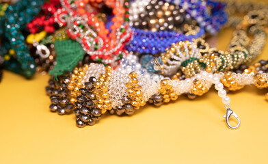Beads, Jewelery, beads necklace on yellow background. 